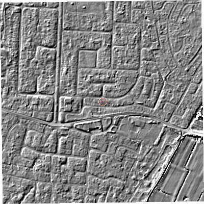 Shaded relief map of the ground around TA64JT, computed from Environment Agency LiDAR. The ground here sits at about 6 m above sea level and falls 5 m across the surrounding 800 m. Surface water reaching this point runs off ground lying to the west, 1.2 m higher.