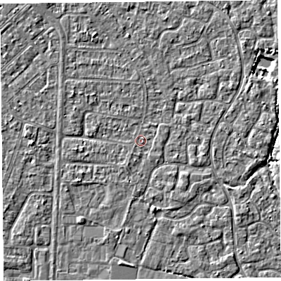 Shaded relief map of the ground around TA64QG, computed from Environment Agency LiDAR. The ground here sits at about 6 m above sea level and falls 3 m across the surrounding 800 m. Surface water reaching this point runs off ground lying to the north-north-west, 1.8 m higher.
