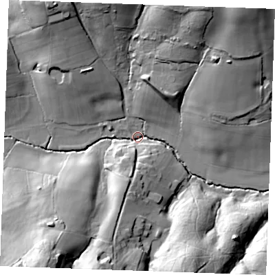 Shaded relief map of the ground around TN395JB, computed from Environment Agency LiDAR. The ground here sits at about 12 m above sea level and falls 33 m across the surrounding 800 m. Surface water reaching this point runs off ground lying to the south-west, 31.3 m higher.