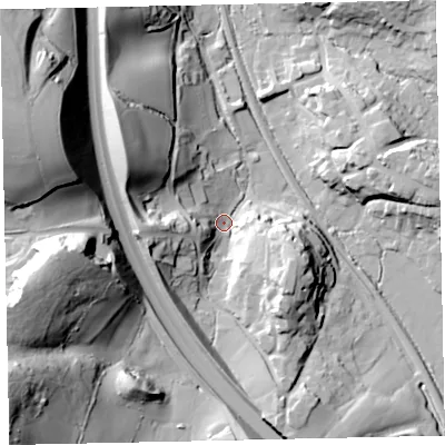 Shaded relief map of the ground around TQ125DS, computed from Environment Agency LiDAR. The ground here sits at about 22 m above sea level and falls 65 m across the surrounding 800 m. Surface water reaching this point runs off ground lying to the west, 24.7 m higher.