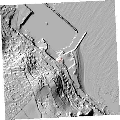 Shaded relief map of the ground around TR185JZ, computed from Environment Agency LiDAR. The ground here sits at about 9 m above sea level and falls 103 m across the surrounding 800 m. Surface water reaching this point runs off ground lying to the south-west, 16.5 m higher.