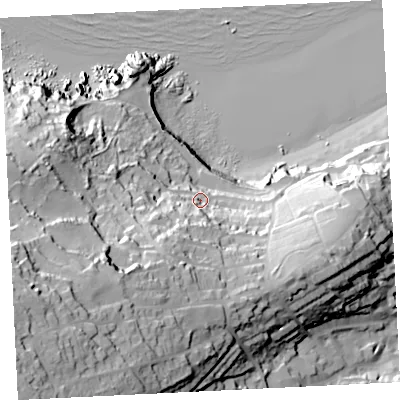 Shaded relief map of the ground around TR261JY, computed from Environment Agency LiDAR. The ground here sits at about 24 m above sea level and falls 91 m across the surrounding 800 m. Surface water reaching this point runs off ground lying to the south-west, 65.5 m higher.