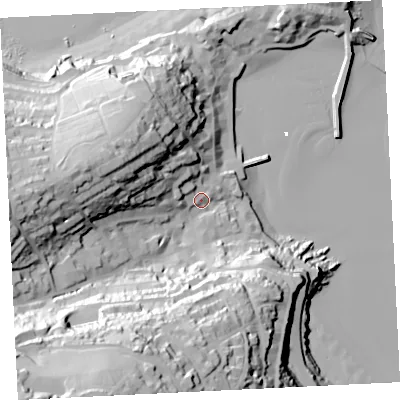 Shaded relief map of the ground around TR261RS, computed from Environment Agency LiDAR. The ground here sits at about 12 m above sea level and falls 85 m across the surrounding 800 m. Surface water reaching this point runs off ground lying to the south-west, 72.1 m higher.