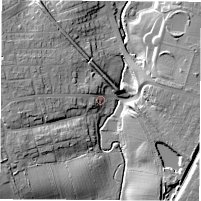 Shaded relief map of the ground around TS185BD, computed from Environment Agency LiDAR. The ground here sits at about 12 m above sea level and falls 15 m across the surrounding 800 m. Surface water reaching this point runs off ground lying to the west-north-west, 10.4 m higher.