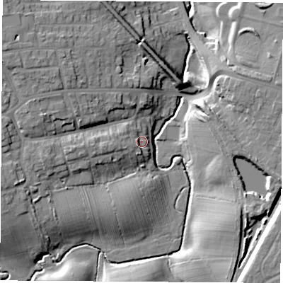 Shaded relief map of the ground around TS185DZ, computed from Environment Agency LiDAR. The ground here sits at about 12 m above sea level and falls 15 m across the surrounding 800 m. Surface water reaching this point runs off ground lying to the west, 5.2 m higher.