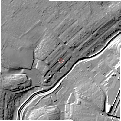 Shaded relief map of the ground around TS190DJ, computed from Environment Agency LiDAR. The ground here sits at about 12 m above sea level and falls 17 m across the surrounding 800 m. Surface water reaching this point runs off ground lying to the north, 2.9 m higher.