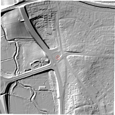 Shaded relief map of the ground around TS231PB, computed from Environment Agency LiDAR. The ground here sits at about 12 m above sea level and falls 25 m across the surrounding 800 m. Surface water reaching this point runs off ground lying to the north-west, 19.9 m higher.