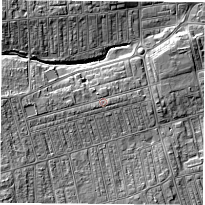 Shaded relief map of the ground around TS255RE, computed from Environment Agency LiDAR. The ground here sits at about 12 m above sea level and falls 10 m across the surrounding 800 m. Surface water reaching this point runs off ground lying to the west-south-west, 2.1 m higher.