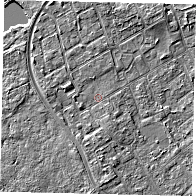 Shaded relief map of the ground around TW107BG, computed from Environment Agency LiDAR. The ground here sits at about 7 m above sea level and falls 6 m across the surrounding 800 m. Surface water reaching this point runs off ground lying to the south, 2.4 m higher.