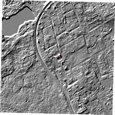 Shaded relief map of the ground around TW107PW, computed from Environment Agency LiDAR. The ground here sits at about 9 m above sea level and falls 6 m across the surrounding 800 m. Surface water reaching this point runs off ground lying to the west, 1.8 m higher.