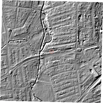Shaded relief map of the ground around TW11AS, computed from Environment Agency LiDAR. The ground here sits at about 6 m above sea level and falls 7 m across the surrounding 800 m. Surface water reaching this point runs off ground lying to the east-north-east, 2.9 m higher.