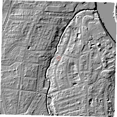 Shaded relief map of the ground around TW11NZ, computed from Environment Agency LiDAR. The ground here sits at about 5 m above sea level and falls 10 m across the surrounding 800 m. Surface water reaching this point runs off ground lying to the south, 2.4 m higher.