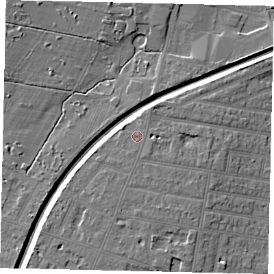 Shaded relief map of the ground around TW121JY, computed from Environment Agency LiDAR. The ground here sits at about 16 m above sea level and falls 8 m across the surrounding 800 m. Surface water reaching this point runs off ground lying to the south, 1.0 m higher.