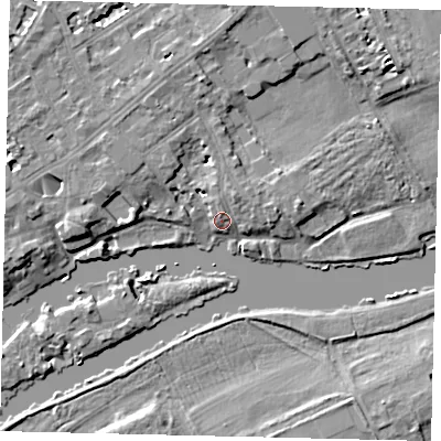 Shaded relief map of the ground around TW13DN, computed from Environment Agency LiDAR. The ground here sits at about 6 m above sea level and falls 7 m across the surrounding 800 m. Surface water reaching this point runs off ground lying to the north, 5.2 m higher.