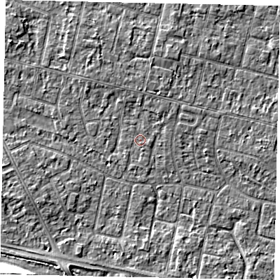 Shaded relief map of the ground around TW151JB, computed from Environment Agency LiDAR. The ground here sits at about 13 m above sea level and falls 12 m across the surrounding 800 m. Surface water reaching this point runs off ground lying to the north, 1.0 m higher.