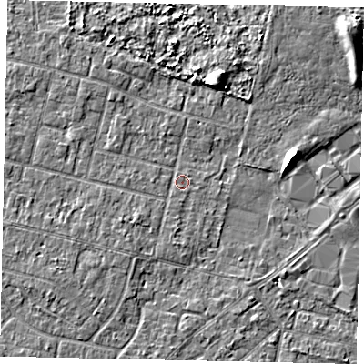 Shaded relief map of the ground around TW151PE, computed from Environment Agency LiDAR. The ground here sits at about 13 m above sea level and falls 6 m across the surrounding 800 m. Surface water reaching this point runs off ground lying to the south-west, 1.3 m higher.