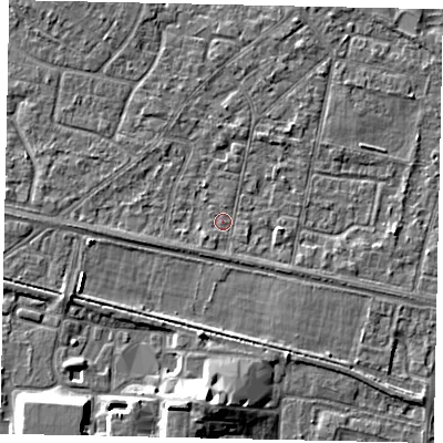 Shaded relief map of the ground around TW151TX, computed from Environment Agency LiDAR. The ground here sits at about 13 m above sea level and falls 8 m across the surrounding 800 m. Surface water reaching this point runs off ground lying to the south-west, 1.1 m higher.