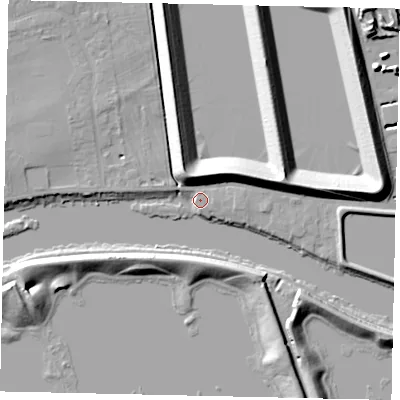 Shaded relief map of the ground around TW165PR, computed from Environment Agency LiDAR. The ground here sits at about 10 m above sea level and falls 12 m across the surrounding 800 m. Surface water reaching this point runs off ground lying to the north-north-west, 11.8 m higher.