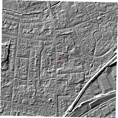 Shaded relief map of the ground around TW167QX, computed from Environment Agency LiDAR. The ground here sits at about 12 m above sea level and falls 4 m across the surrounding 800 m. Surface water reaching this point runs off ground lying to the north, 1.2 m higher.