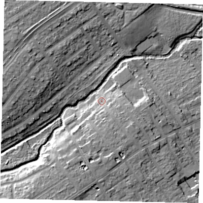 Shaded relief map of the ground around TW25BZ, computed from Environment Agency LiDAR. The ground here sits at about 12 m above sea level and falls 12 m across the surrounding 800 m. Surface water reaching this point runs off ground lying to the south-south-east, 6.1 m higher.