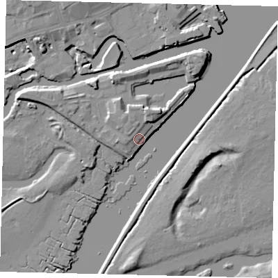 Shaded relief map of the ground around TW88QE, computed from Environment Agency LiDAR. The ground here sits at about 6 m above sea level and falls 10 m across the surrounding 800 m. Surface water reaching this point runs off ground lying to the west-north-west, 6.5 m higher.
