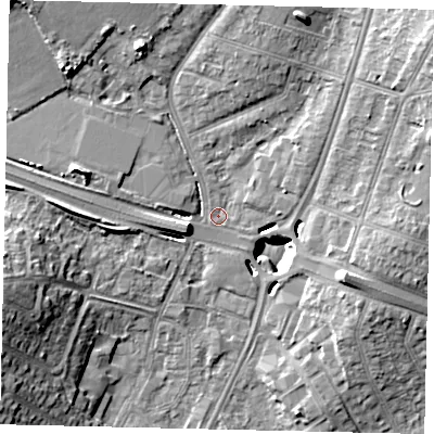 Shaded relief map of the ground around UB69FP, computed from Environment Agency LiDAR. The ground here sits at about 18 m above sea level and falls 16 m across the surrounding 800 m. Surface water reaching this point runs off ground lying to the north-west, 11.1 m higher.