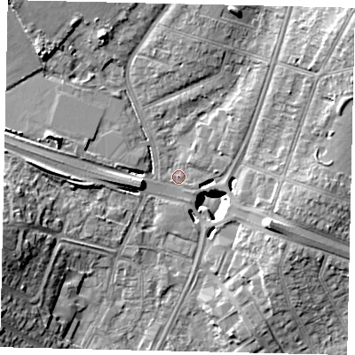 Shaded relief map of the ground around UB69JP, computed from Environment Agency LiDAR. The ground here sits at about 18 m above sea level and falls 15 m across the surrounding 800 m. Surface water reaching this point runs off ground lying to the north-west, 11.0 m higher.