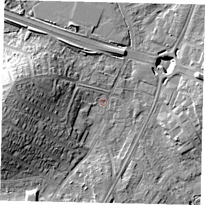 Shaded relief map of the ground around UB69JT, computed from Environment Agency LiDAR. The ground here sits at about 17 m above sea level and falls 20 m across the surrounding 800 m. Surface water reaching this point runs off ground lying to the west, 16.8 m higher.
