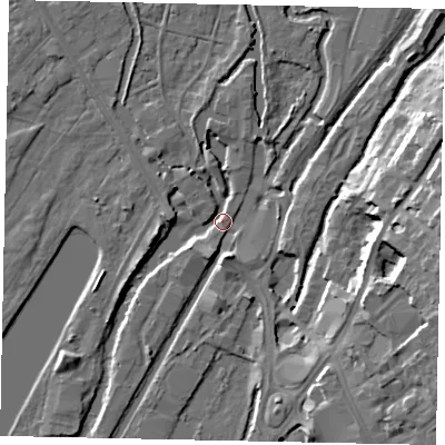 Shaded relief map of the ground around UB81LZ, computed from Environment Agency LiDAR. The ground here sits at about 33 m above sea level and falls 17 m across the surrounding 800 m. Surface water reaching this point runs off ground lying to the east, 15.4 m higher.