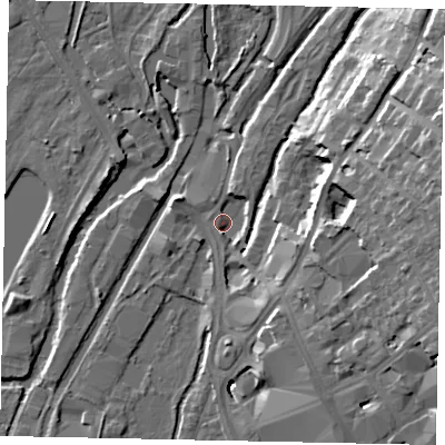 Shaded relief map of the ground around UB81NA, computed from Environment Agency LiDAR. The ground here sits at about 33 m above sea level and falls 21 m across the surrounding 800 m. Surface water reaching this point runs off ground lying to the east-north-east, 18.4 m higher.