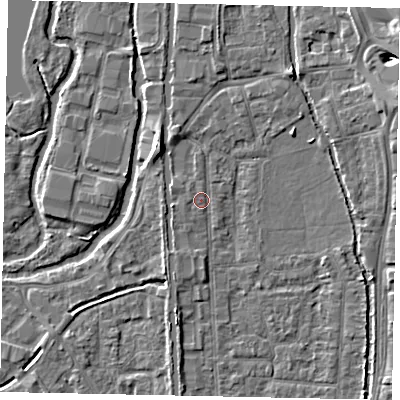 Shaded relief map of the ground around UB82QX, computed from Environment Agency LiDAR. The ground here sits at about 32 m above sea level and falls 7 m across the surrounding 800 m. Surface water reaching this point runs off ground lying to the south-south-east, 0.6 m higher.
