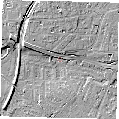 Shaded relief map of the ground around W43XQ, computed from Environment Agency LiDAR. The ground here sits at about 5 m above sea level and falls 13 m across the surrounding 800 m. Surface water reaching this point runs off ground lying to the west-north-west, 9.9 m higher.
