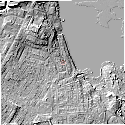 Shaded relief map of the ground around WN35JX, computed from Environment Agency LiDAR. The ground here sits at about 27 m above sea level and falls 14 m across the surrounding 800 m. Surface water reaching this point runs off ground lying to the north-west, 8.2 m higher.