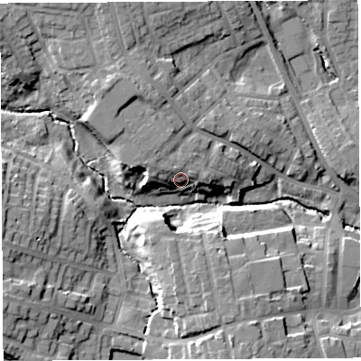 Shaded relief map of the ground around WN49PY, computed from Environment Agency LiDAR. The ground here sits at about 54 m above sea level and falls 14 m across the surrounding 800 m. Surface water reaching this point runs off ground lying to the north-north-west, 8.5 m higher.