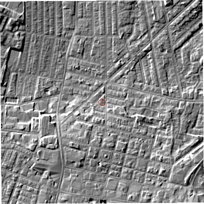 Shaded relief map of the ground around WN71LU, computed from Environment Agency LiDAR. The ground here sits at about 25 m above sea level and falls 7 m across the surrounding 800 m. Surface water reaching this point runs off ground lying to the south, 3.8 m higher.