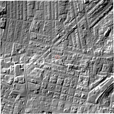 Shaded relief map of the ground around WN71LX, computed from Environment Agency LiDAR. The ground here sits at about 25 m above sea level and falls 7 m across the surrounding 800 m. Surface water reaching this point runs off ground lying to the south, 4.7 m higher.