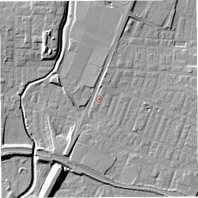 Shaded relief map of the ground around WN74EQ, computed from Environment Agency LiDAR. The ground here sits at about 26 m above sea level and falls 14 m across the surrounding 800 m. Surface water reaching this point runs off ground lying to the north-north-east, 3.5 m higher.