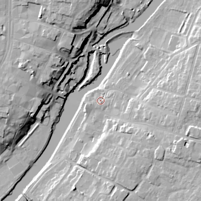Shaded relief map of the ground around WR113HF, computed from Environment Agency LiDAR. The ground here sits at about 23 m above sea level and falls 23 m across the surrounding 800 m. Surface water reaching this point runs off ground lying to the east, 2.2 m higher.