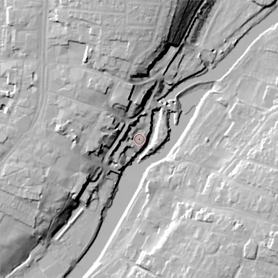 Shaded relief map of the ground around WR114HW, computed from Environment Agency LiDAR. The ground here sits at about 24 m above sea level and falls 24 m across the surrounding 800 m. Surface water reaching this point runs off ground lying to the west-south-west, 5.4 m higher.