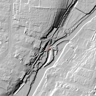 Shaded relief map of the ground around WR114PT, computed from Environment Agency LiDAR. The ground here sits at about 24 m above sea level and falls 26 m across the surrounding 800 m. Surface water reaching this point runs off ground lying to the north-west, 14.5 m higher.