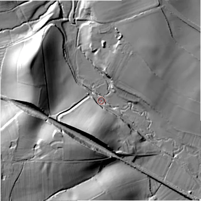 Shaded relief map of the ground around WR80BG, computed from Environment Agency LiDAR. The ground here sits at about 13 m above sea level and falls 28 m across the surrounding 800 m. Surface water reaching this point runs off ground lying to the west-north-west, 25.1 m higher.
