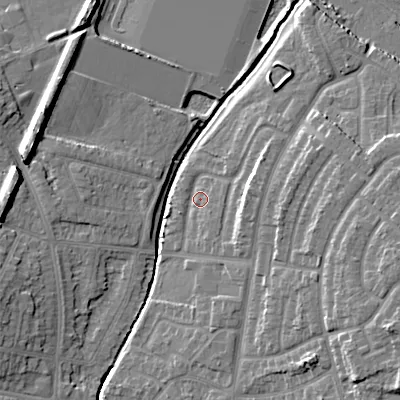 Shaded relief map of the ground around WS100RU, computed from Environment Agency LiDAR. The ground here sits at about 115 m above sea level and falls 14 m across the surrounding 800 m. Surface water reaching this point runs off ground lying to the east, 5.4 m higher.