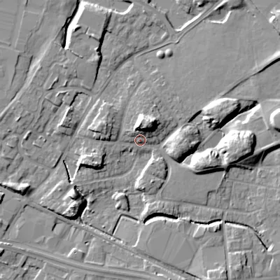 Shaded relief map of the ground around WV133DA, computed from Environment Agency LiDAR. The ground here sits at about 130 m above sea level and falls 13 m across the surrounding 800 m. Surface water reaching this point runs off ground lying to the north, 9.4 m higher.