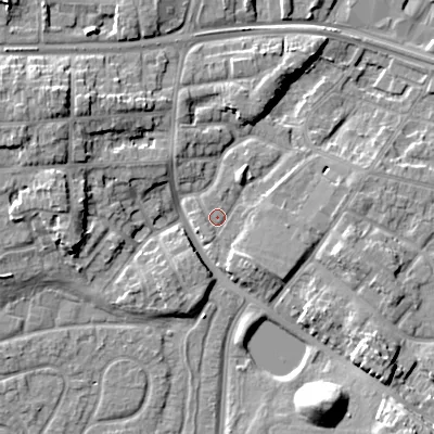 Shaded relief map of the ground around WV133QG, computed from Environment Agency LiDAR. The ground here sits at about 131 m above sea level and falls 12 m across the surrounding 800 m. Surface water reaching this point runs off ground lying to the south-east, 3.3 m higher.