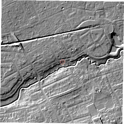Shaded relief map of the ground around YO103RS, computed from Environment Agency LiDAR. The ground here sits at about 12 m above sea level and falls 11 m across the surrounding 800 m. Surface water reaching this point runs off ground lying to the south, 7.2 m higher.