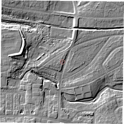 Shaded relief map of the ground around YO103SP, computed from Environment Agency LiDAR. The ground here sits at about 12 m above sea level and falls 10 m across the surrounding 800 m. Surface water reaching this point runs off ground lying to the north-north-east, 2.9 m higher.