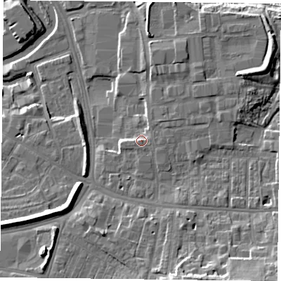 Shaded relief map of the ground around YO103WW, computed from Environment Agency LiDAR. The ground here sits at about 13 m above sea level and falls 15 m across the surrounding 800 m. Surface water reaching this point runs off ground lying to the east-north-east, 2.3 m higher.