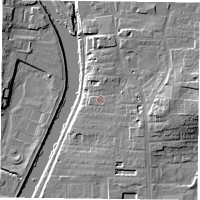 Shaded relief map of the ground around YO104BS, computed from Environment Agency LiDAR. The ground here sits at about 12 m above sea level and falls 16 m across the surrounding 800 m. Surface water reaching this point runs off ground lying to the east, 8.7 m higher.