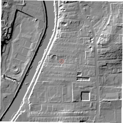 Shaded relief map of the ground around YO104DJ, computed from Environment Agency LiDAR. The ground here sits at about 12 m above sea level and falls 16 m across the surrounding 800 m. Surface water reaching this point runs off ground lying to the east, 4.8 m higher.