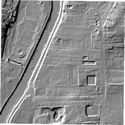 Shaded relief map of the ground around YO104DT, computed from Environment Agency LiDAR. The ground here sits at about 12 m above sea level and falls 15 m across the surrounding 800 m. Surface water reaching this point runs off ground lying to the east, 3.8 m higher.